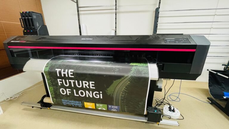 Large format printer printing a "The Future of Longi" banner