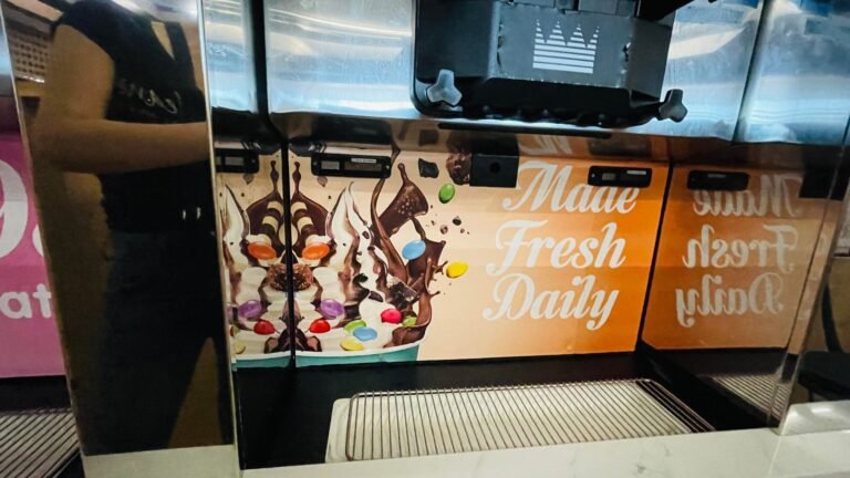 Printed menu and promotional graphics on a bubble tea shopfront
