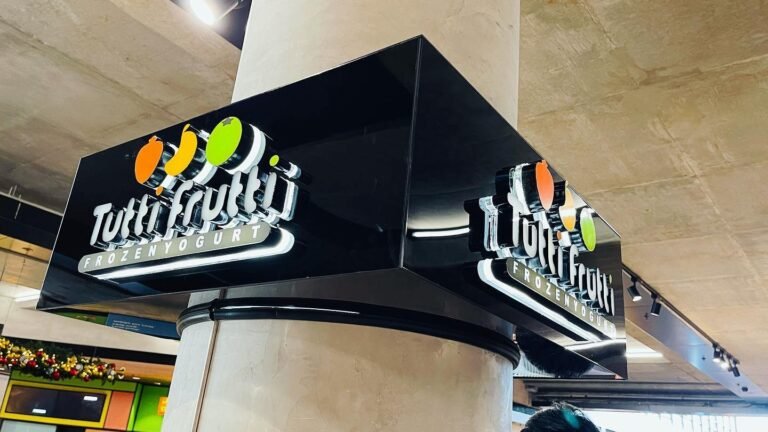 Tutti Frutti illuminated column signage with fruit logo