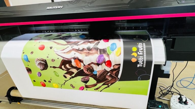 Tutti Frutti promotional graphic coming off a large format printer