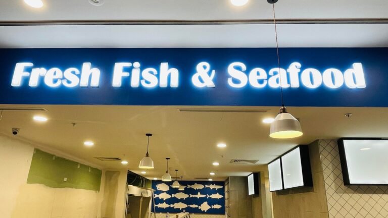 Fresh Fish & Seafood illuminated fascia sign in a shopping centre