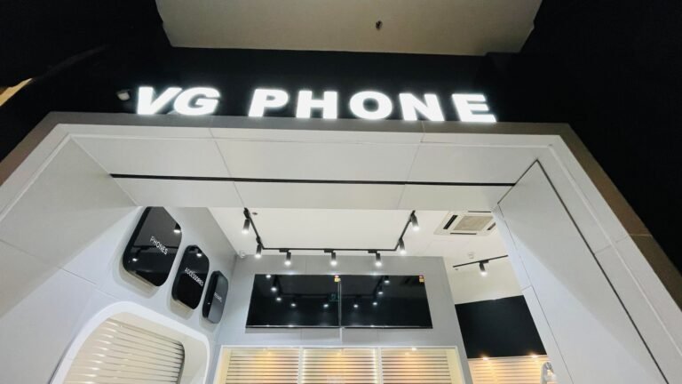 VG Phone illuminated lettering above a phone store interior