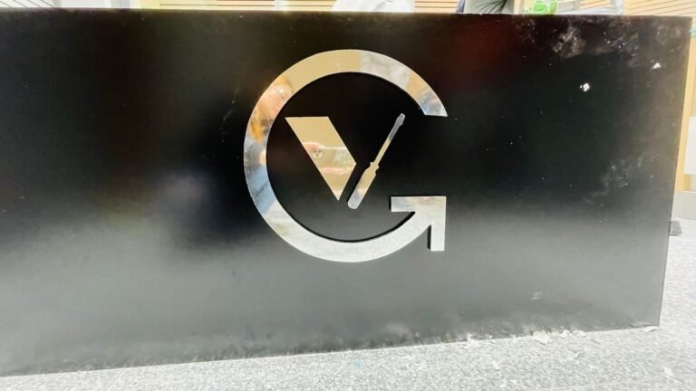 Brushed metal VG logo on a black feature panel