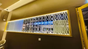 Gold decorative screen and LED-lit display wall in a retail interior