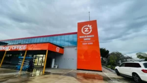Z Nails & Beauty Supply tower sign and orange building fascia
