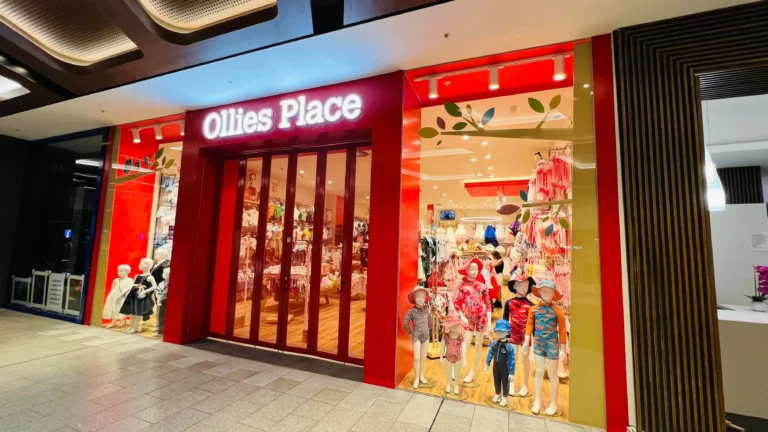 Office Place shopfront with red frame and full-colour window graphics