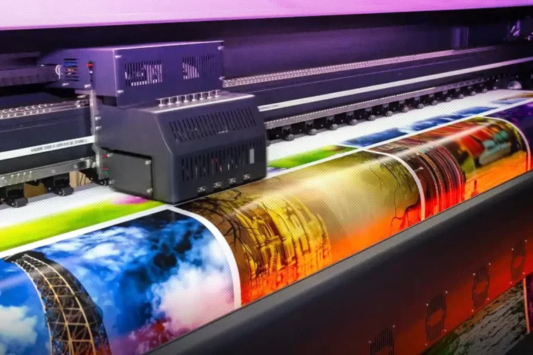 Colourful digital prints coming off a large format printer